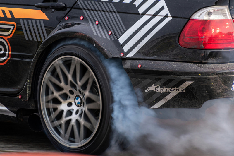 Car doing burnout, hooning